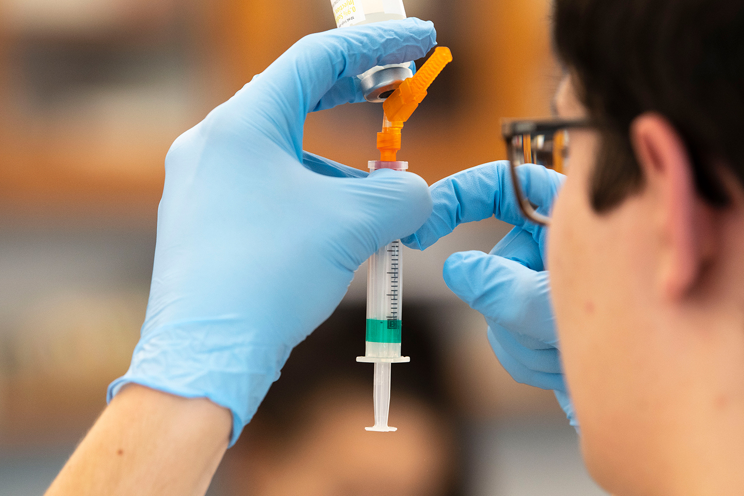 student practicing dosage